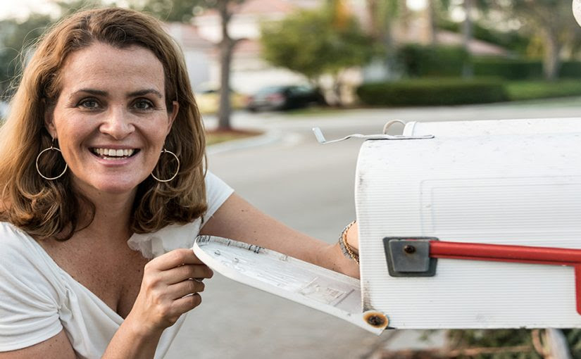 Woman at her mailbox